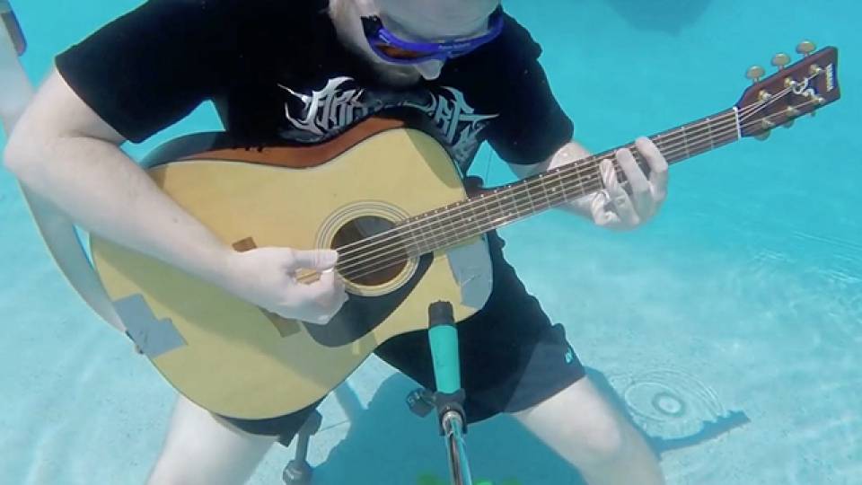 Can You Hear This Underwater Guitarist's Tunes? RTM RightThisMinute