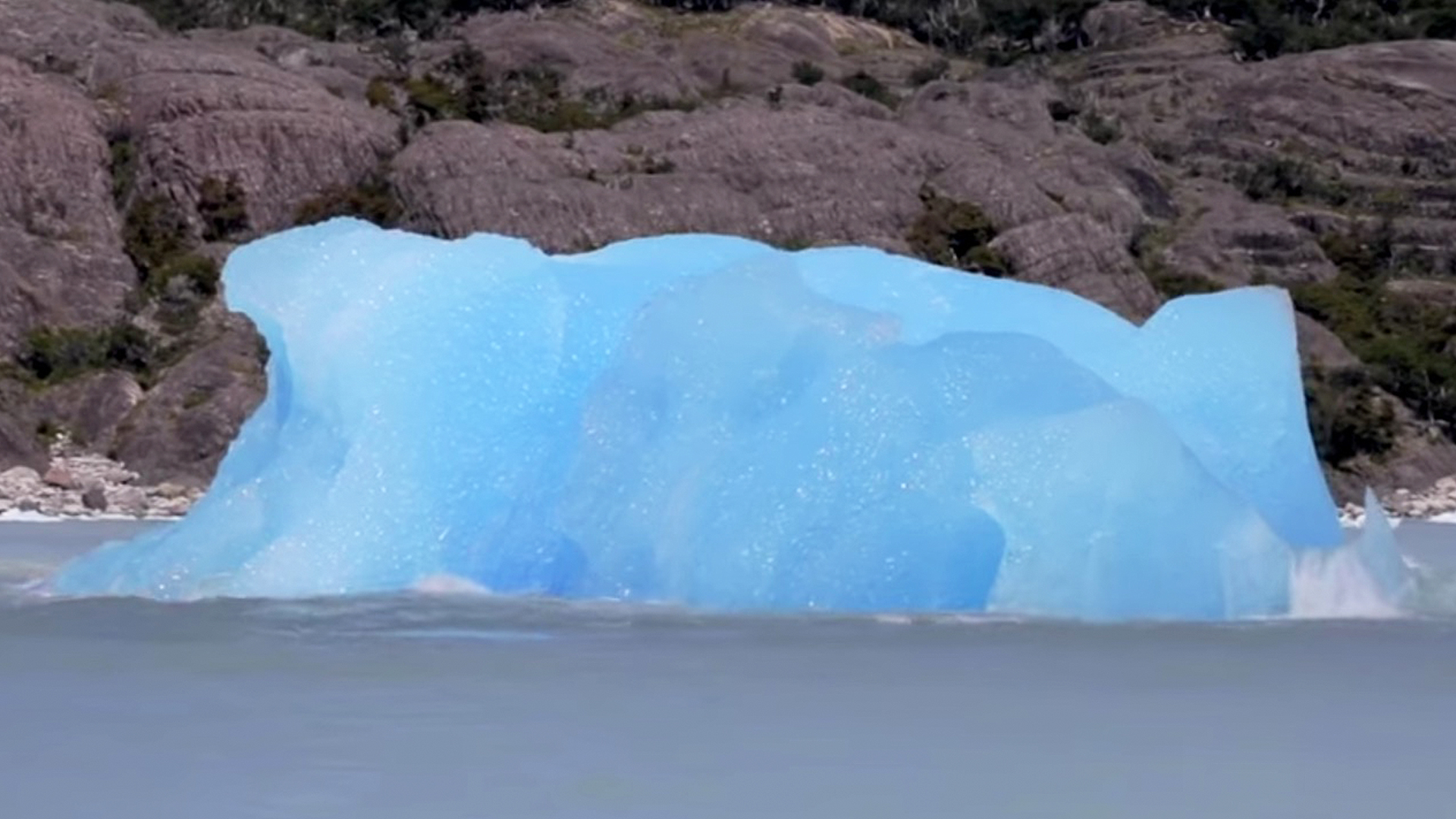 Iceberg Flips Over Revealing Bright Blue Coloring | RTM - RightThisMinute