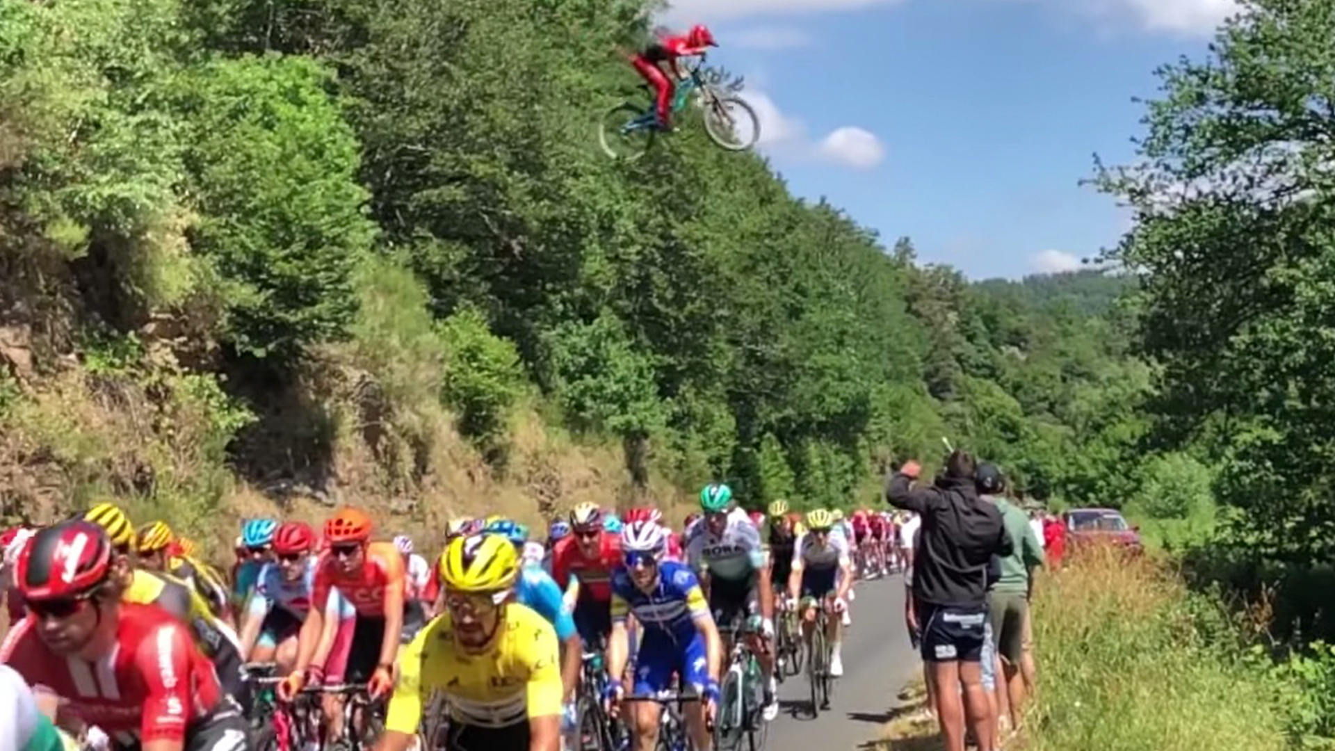 Daring Mountain Biker Jumps Over Tour De France RTM RightThisMinute