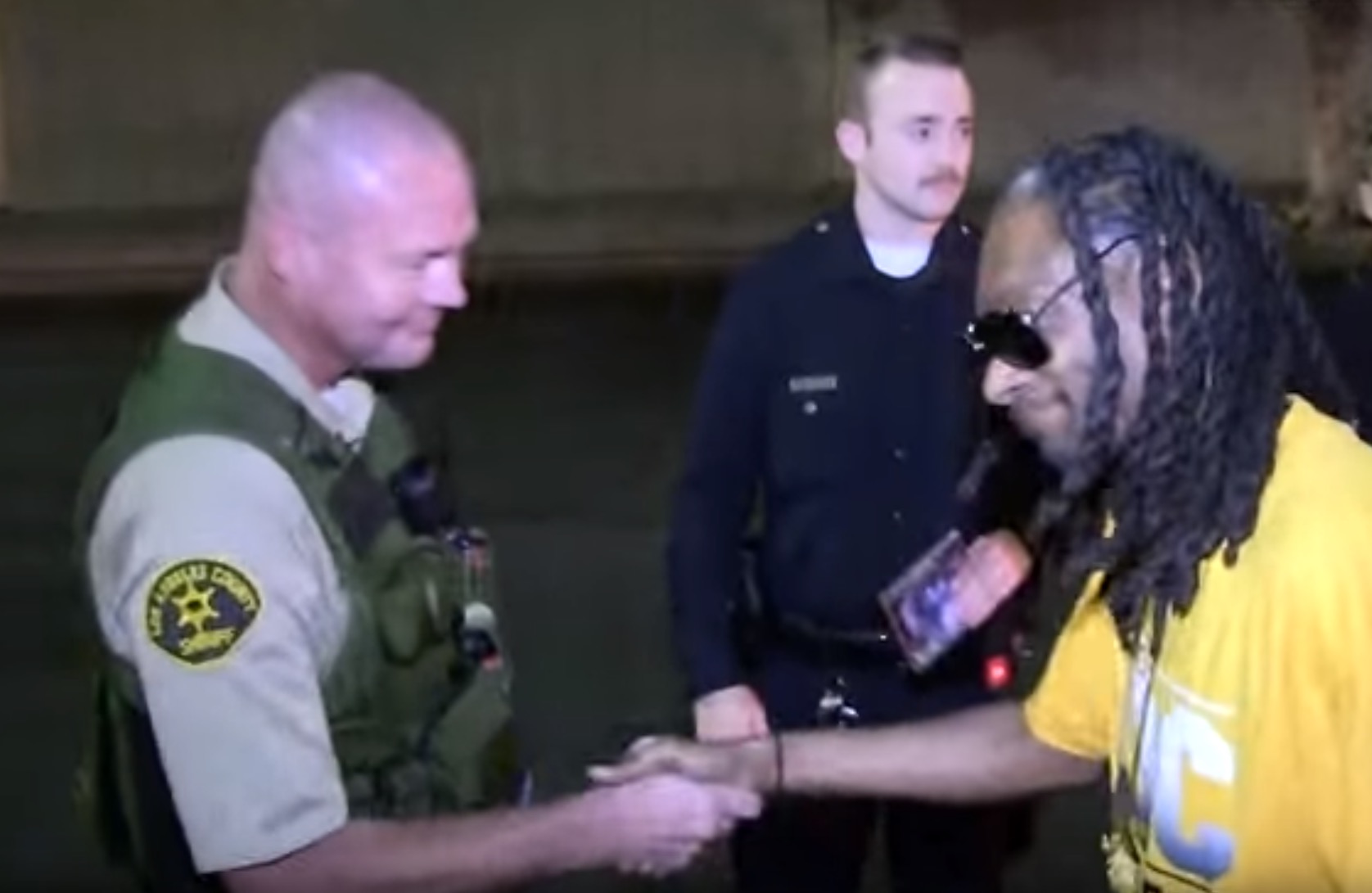 Snoop Dogg Gives CDs to Local Police RTM RightThisMinute